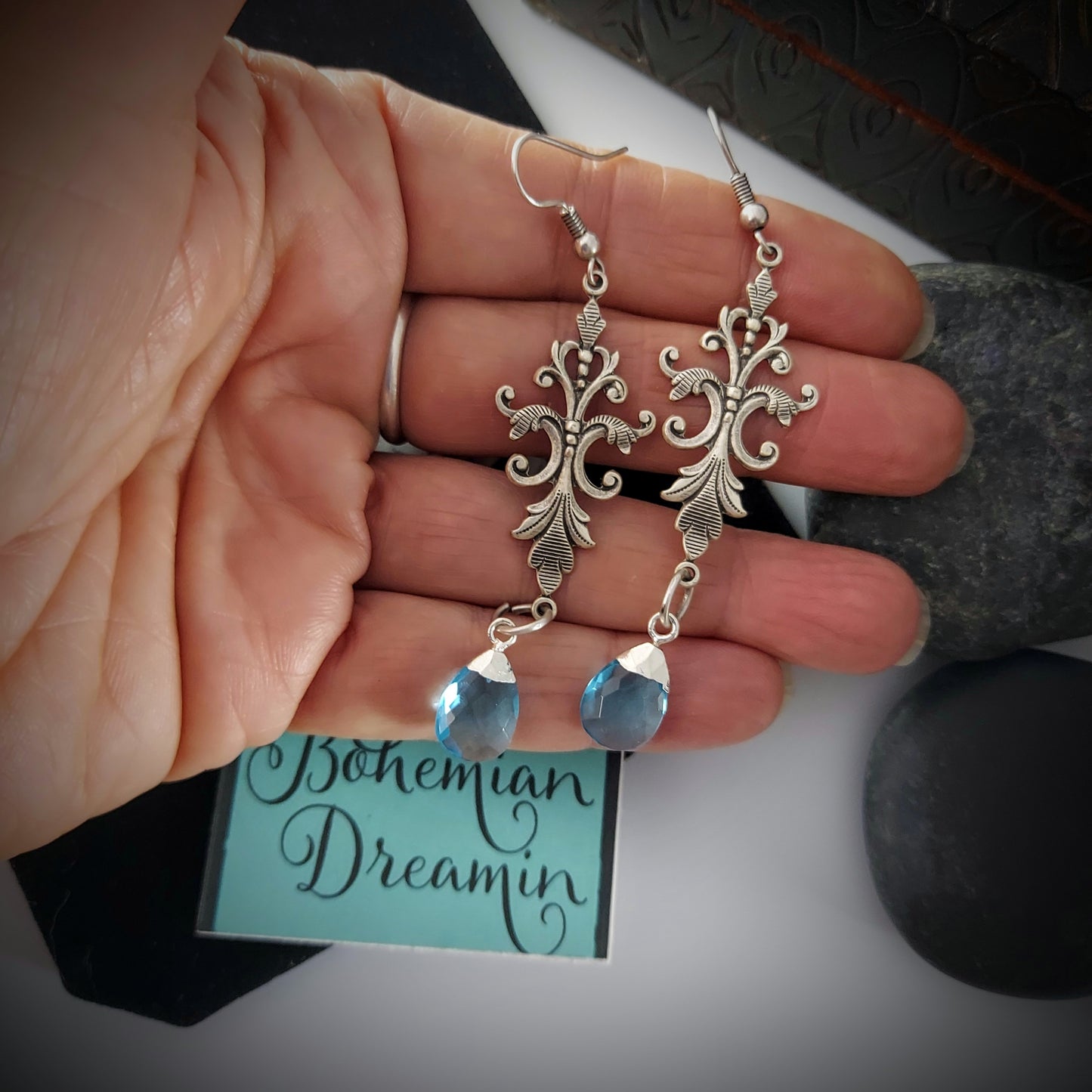Created in our studio, these unique earrings are lightweight and so beautiful to wear! The stunning Blue Topaz dangles from an Art Nouveau Style Filigree base. Really lovely on!
 
Comes in a Black Velvet drawstring bag for safe keeping, or gifting.

 2.5" length with hooks

Genuine Labradorite and Amazonite, Brass